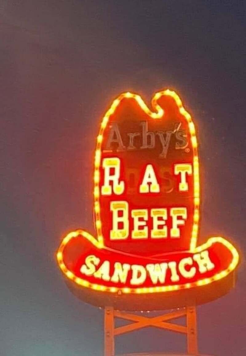 Neon sign for Arby's RAT BEEF SANDWICH with a hat shape.