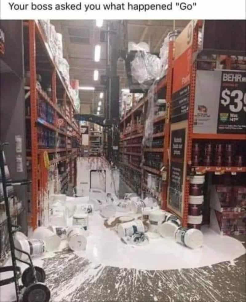 Spilled paint cans in a store aisle with paint on the floor and shelves.