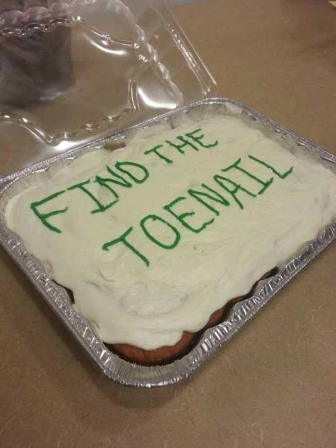  'FIND THE TOENAIL' on white frosting.
