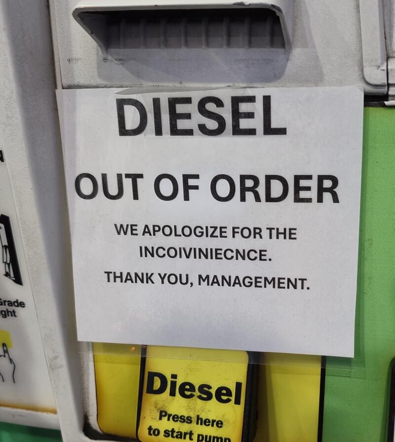 Sign on a fuel pump says 'DIESEL OUT OF ORDER' with a humorous apology.