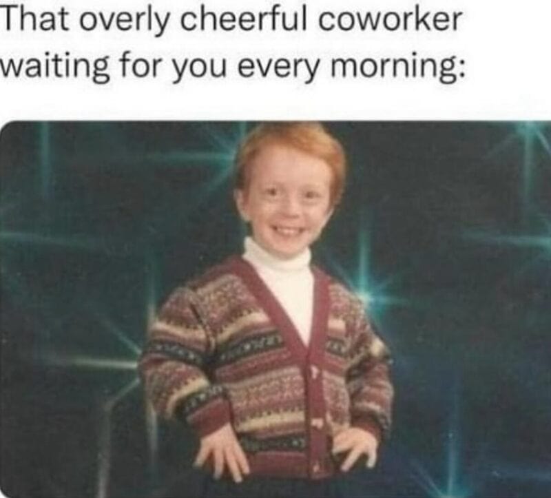 Cheerful young boy in a patterned sweater smiling confidently.