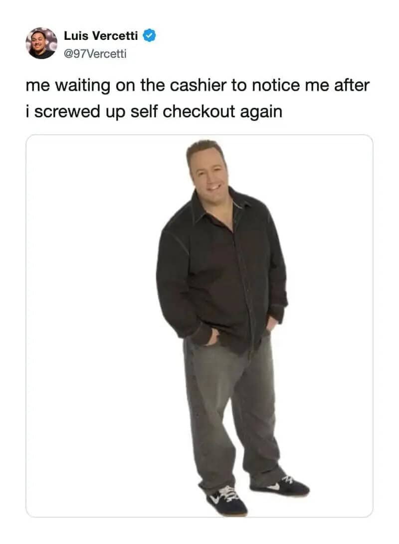 Man smiling, waiting for cashier after messing up self checkout.