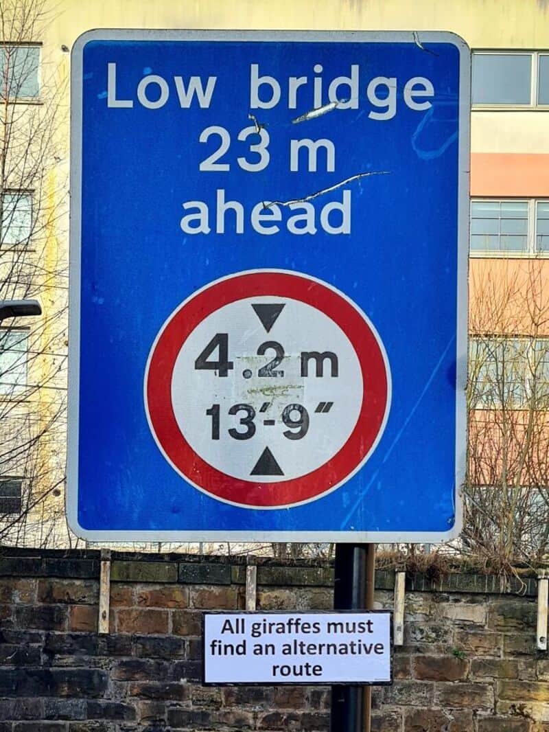 Low bridge 23 m ahead with a height limit of 4.2 m or 13'-9".