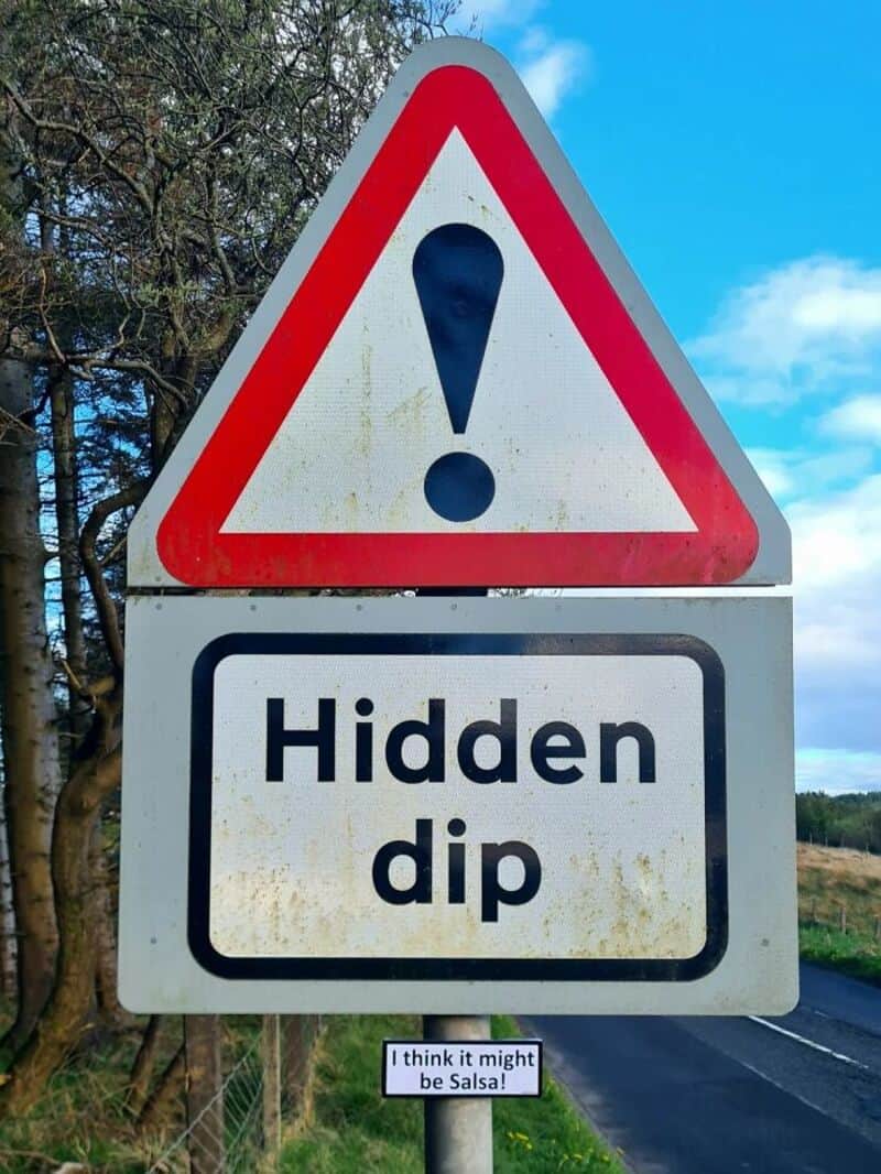 Warning sign with exclamation mark and 'Hidden dip' text.