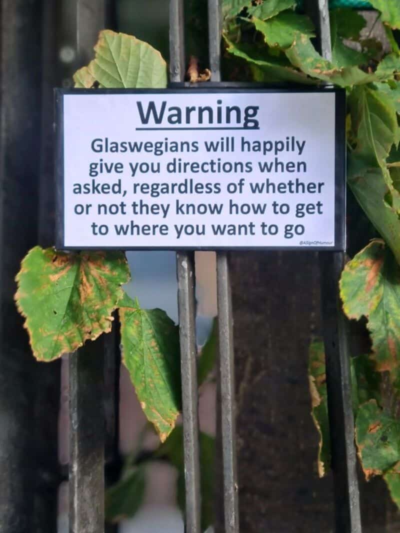 Warning sign about Glaswegians giving directions regardless of knowing how to get there.