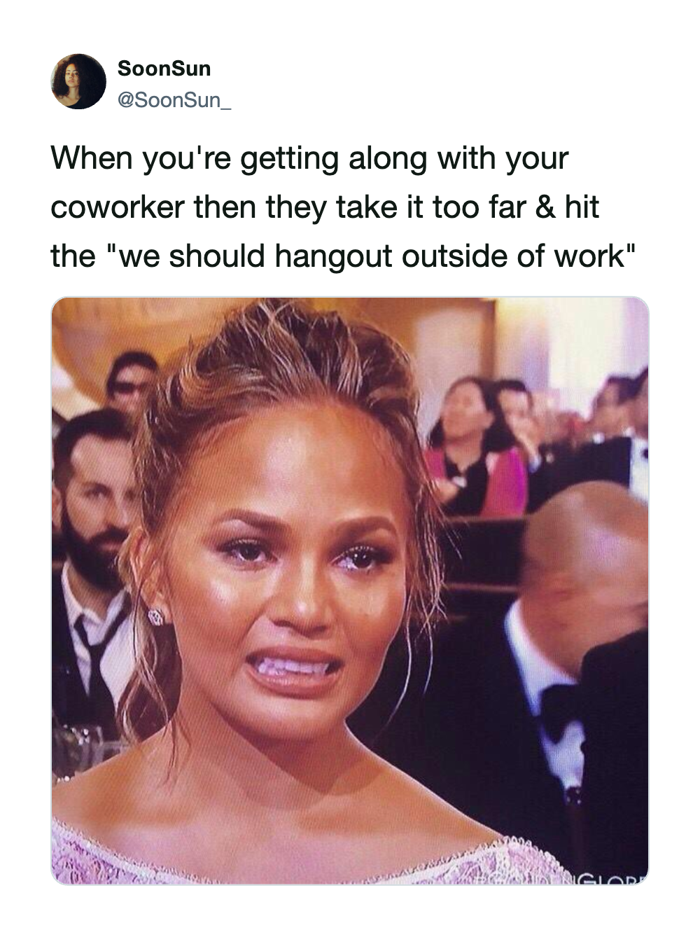 A woman with a distressed expression at a formal event.