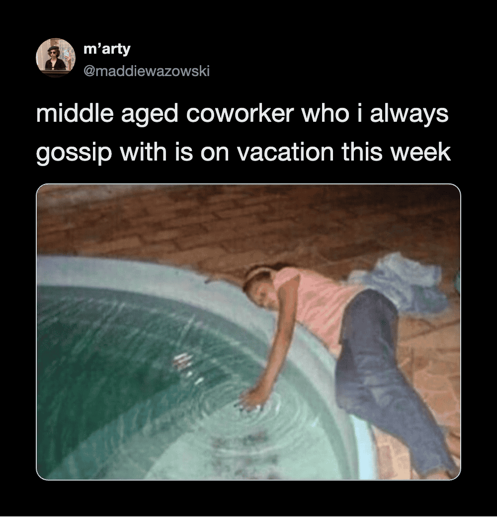 Middle aged woman lying by a pool, touching the water, on vacation.
