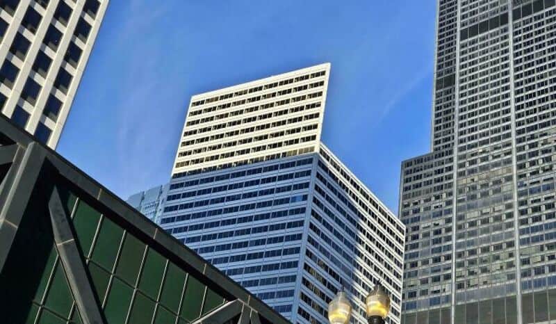 Tall modern skyscrapers with blue sky in the background.