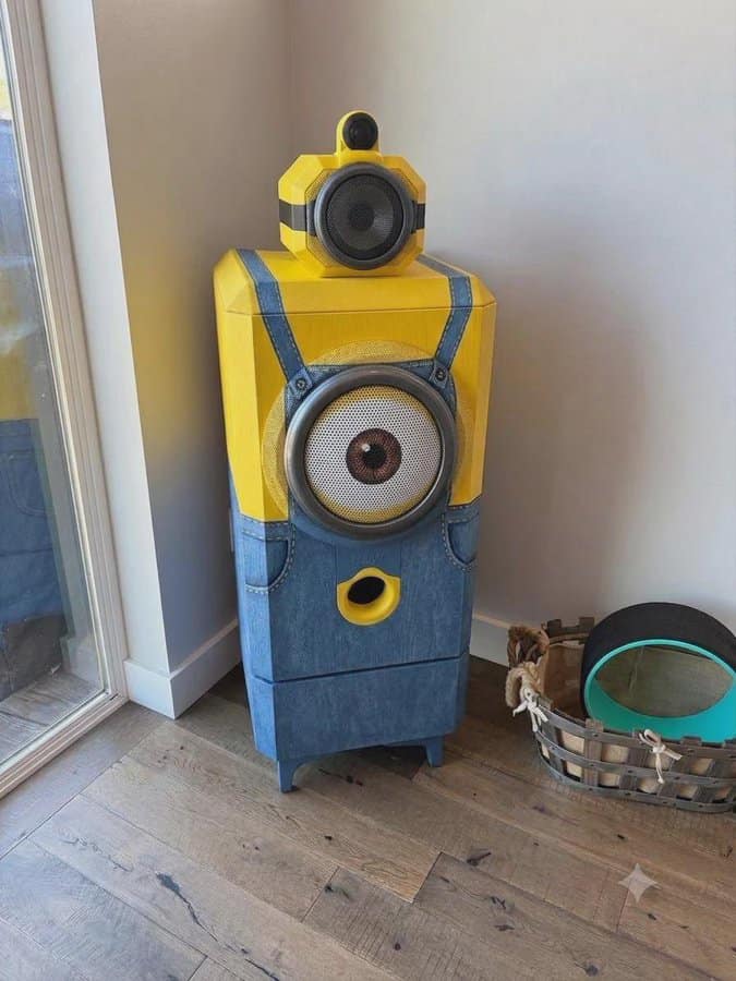 Speaker designed to look like a Minion from Despicable Me, with yellow and blue colors.