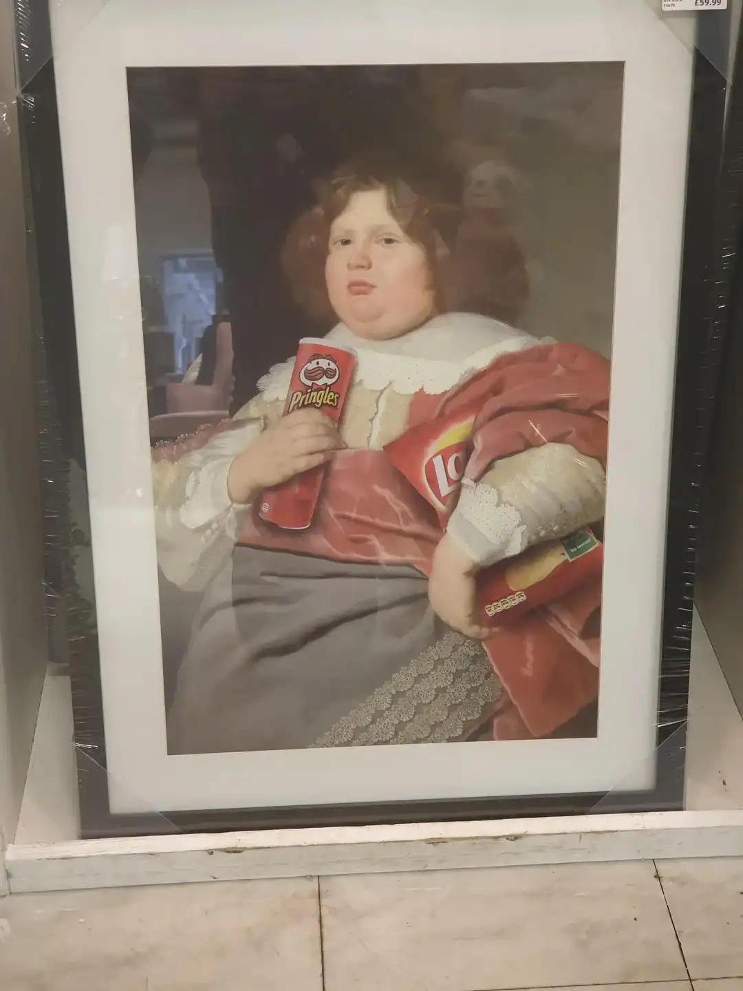 Child with curly hair holding a bag of Lay's chips and a can of Pringles.