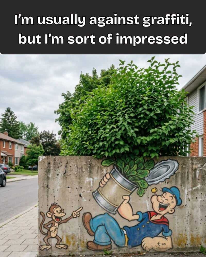 Mural of a man and monkey with a tree growing from a can on a wall.