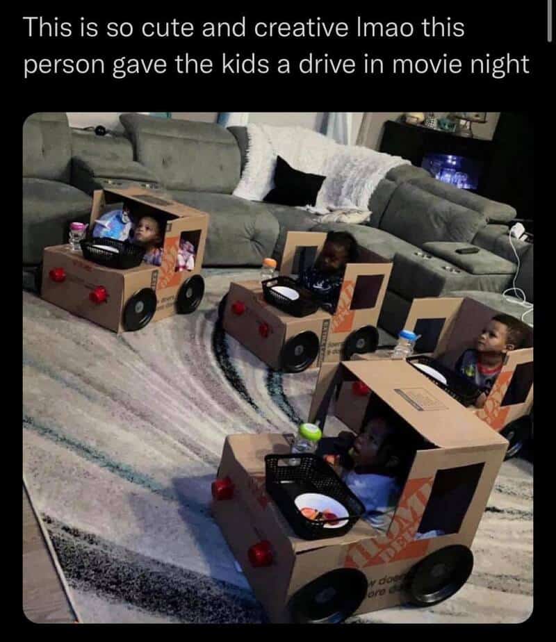 Kids in homemade cardboard car costumes during a drive-in movie night.