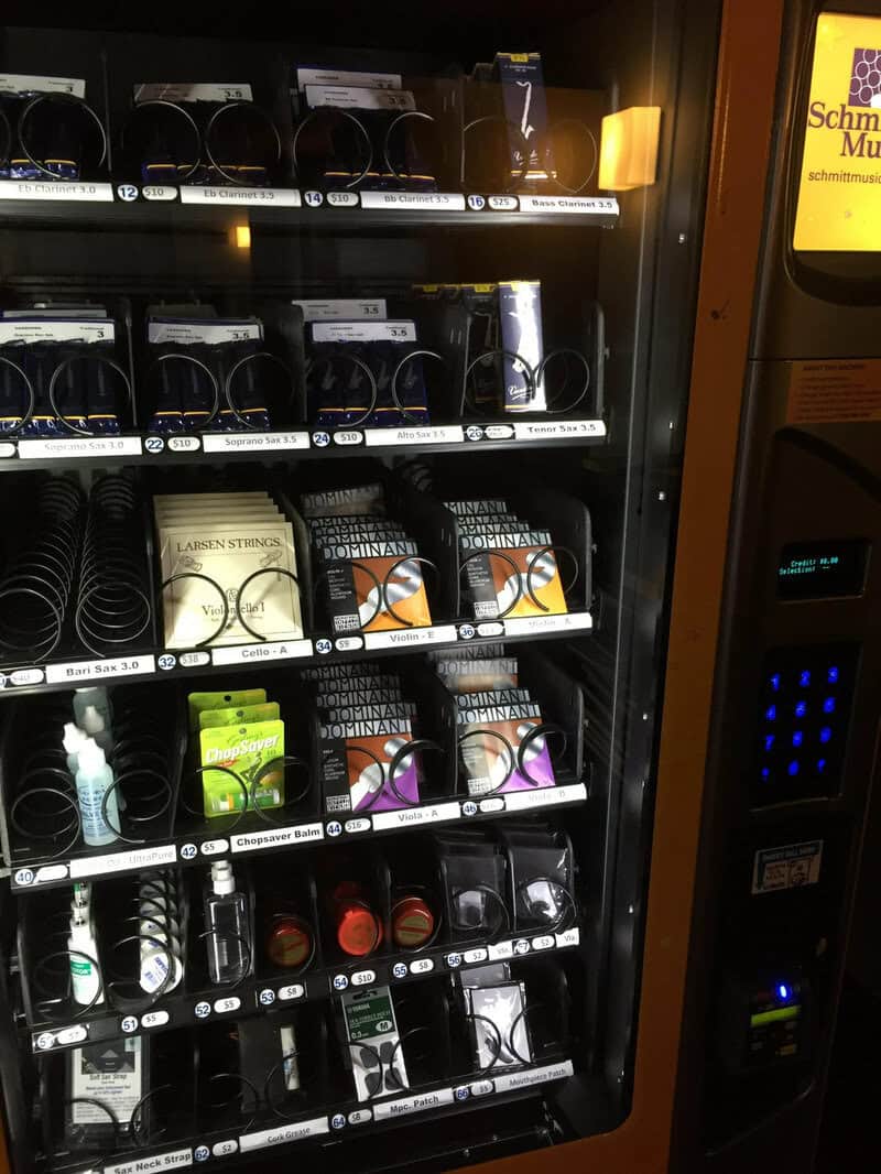 Vending machine with various headphone brands and styles displayed.