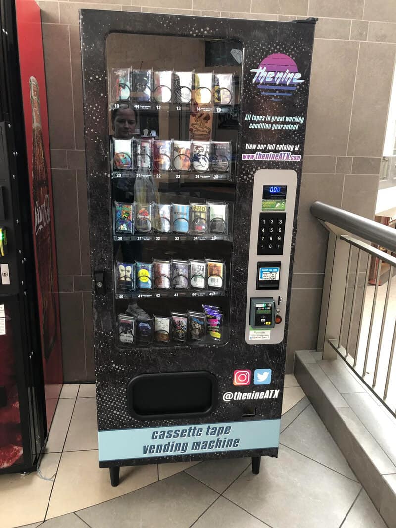 Vending machine for cassette tapes with various tapes inside.