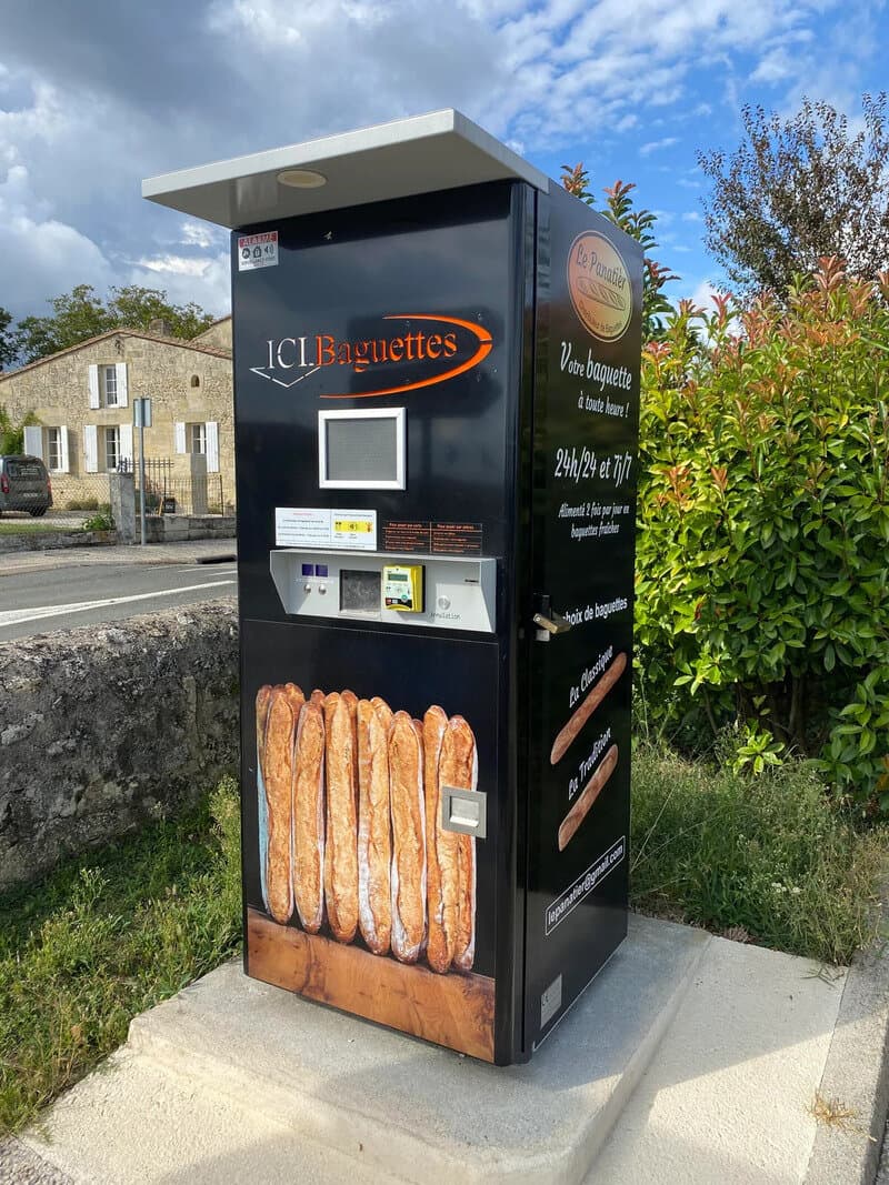 Vending machine for baguettes with a large baguette image at the bottom.