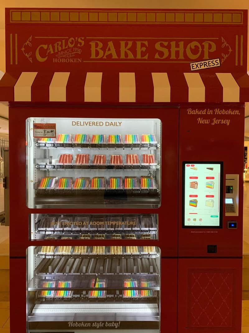 Red vending machine with baked goods and colorful candy, Hoboken, New Jersey.
