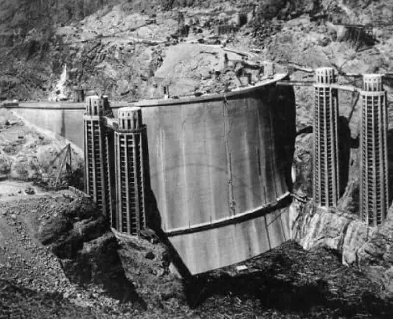 Large dam with water reservoir in a mountainous area.