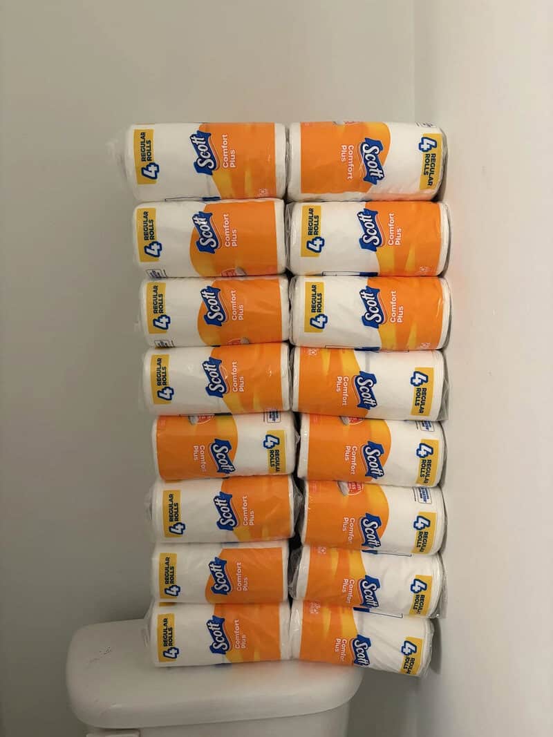 Stack of 10 rolls of Scott paper towels on a white surface.