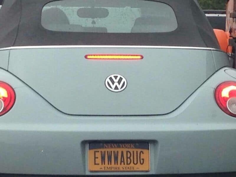 Car with a humorous license plate reading 'EWWABUG'.