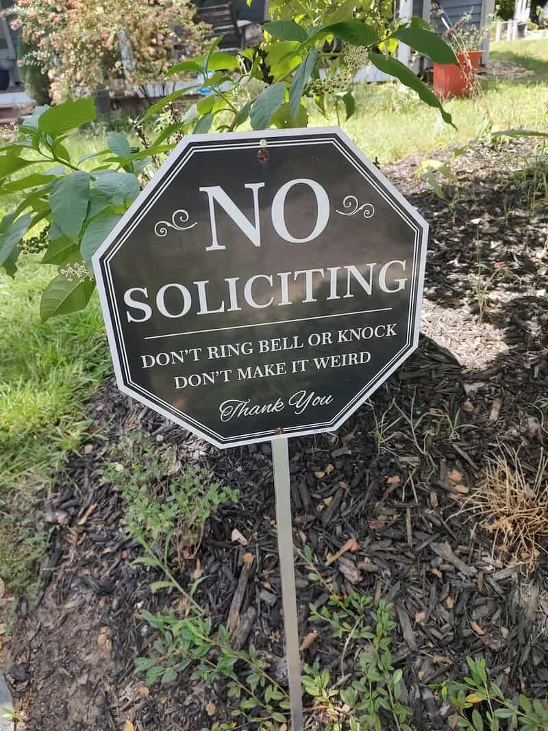 No soliciting sign says don't ring bell or knock, don't make it weird.