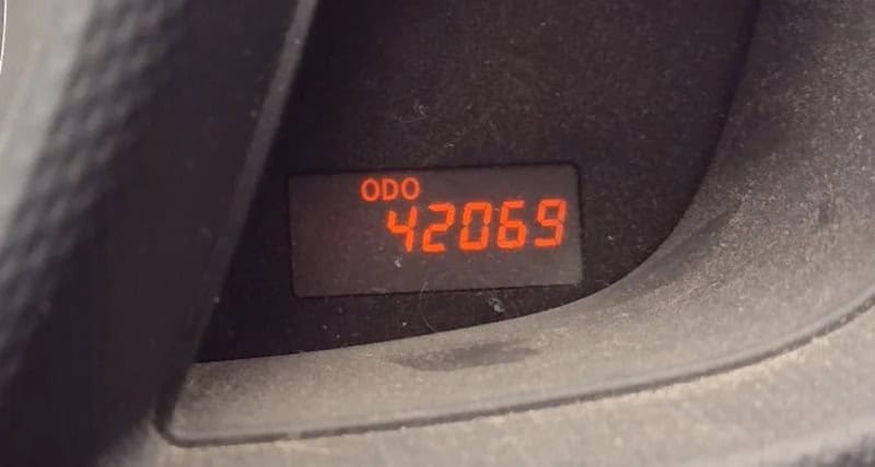 Car odometer reading 42069 in red digital display.