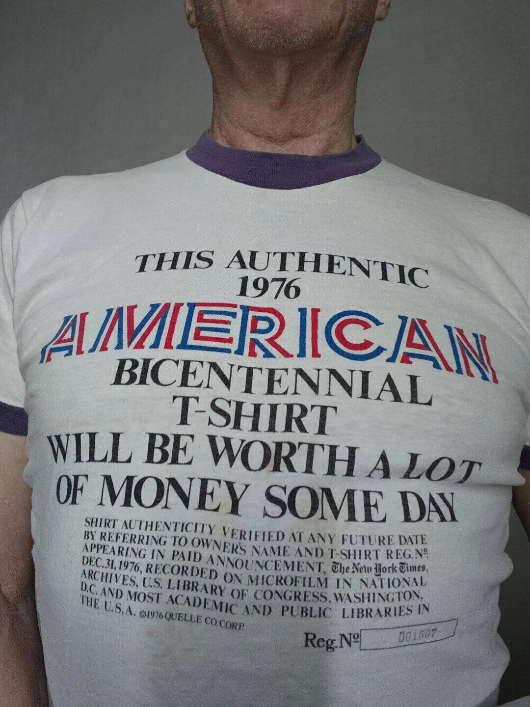 Close-up of a T-shirt with text about American bicentennial, worn by a person.