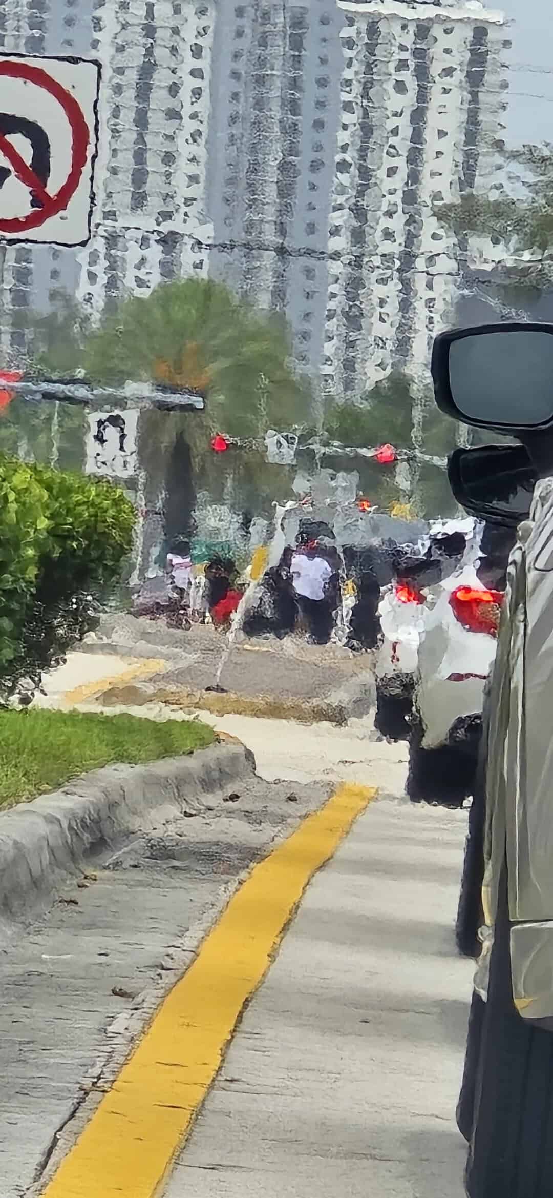 Traffic jam on a city street with tall buildings in the background.