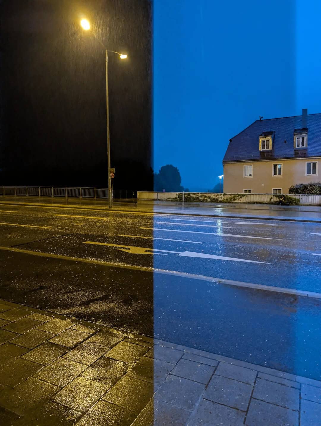 Night scene with streetlamp, rain, and a house, split into dark and blue-lit halves.