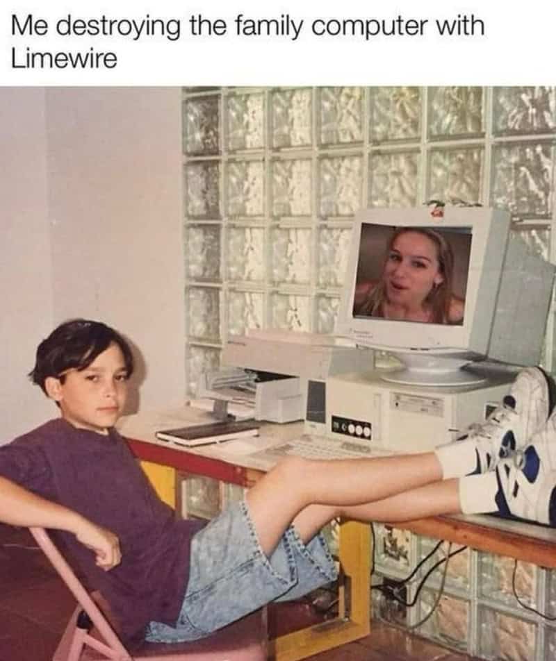 Child with feet on computer, face on monitor, destroying family computer with Limewire.