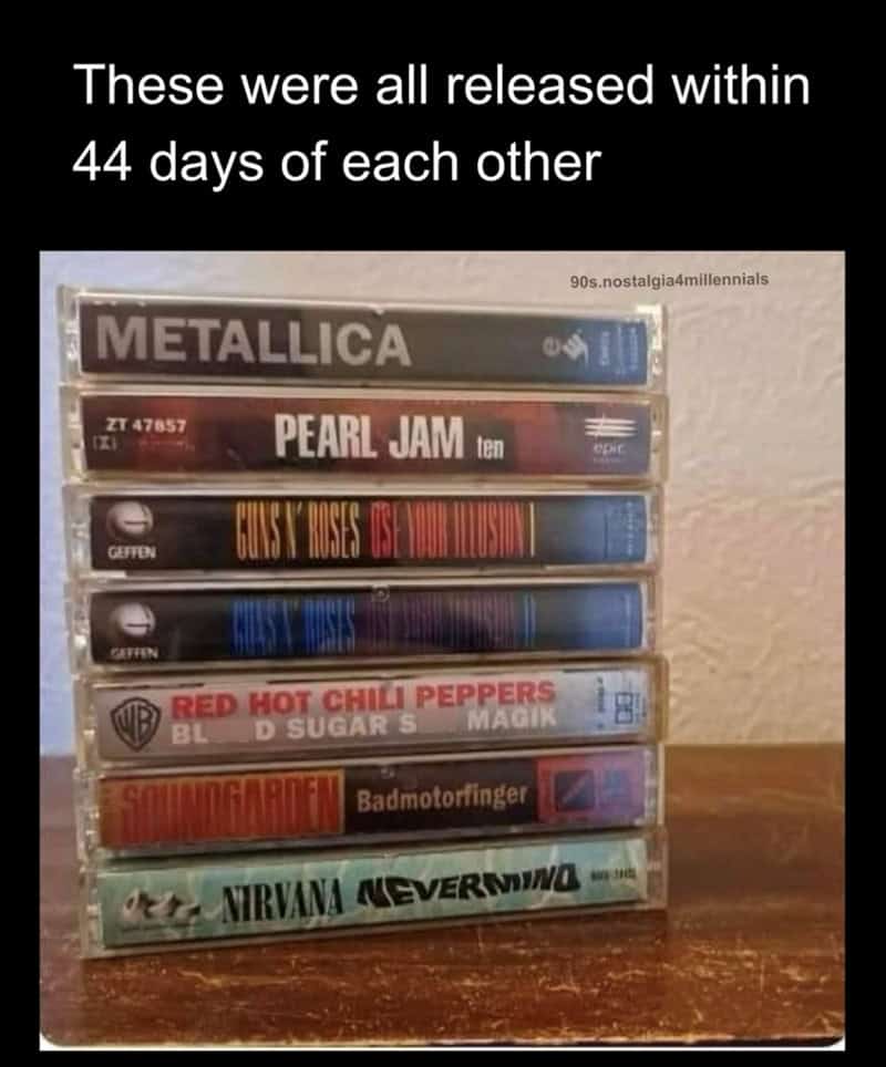 Stack of cassette tapes with bands Metallica, Pearl Jam, Guns N' Roses, Red Hot Chili Peppers, Sound.
