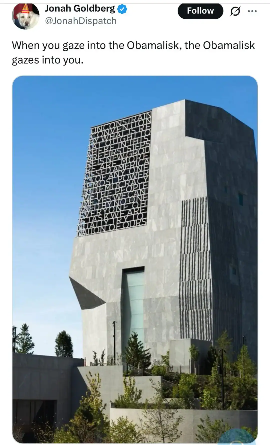 Obamalisk building with a unique design and text pattern on one side.