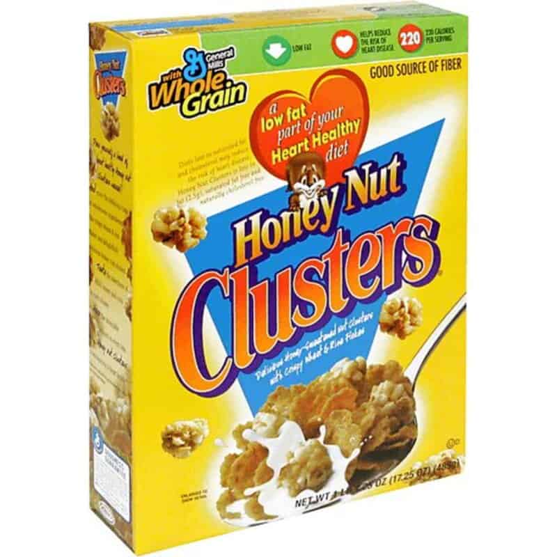 Honey Nut Clusters cereal box with a spoonful of cereal and milk.