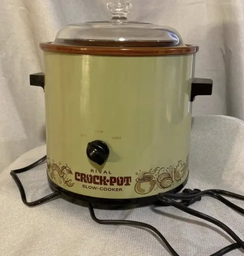 Vintage Rival Crock-Pot slow cooker with floral design and glass lid.