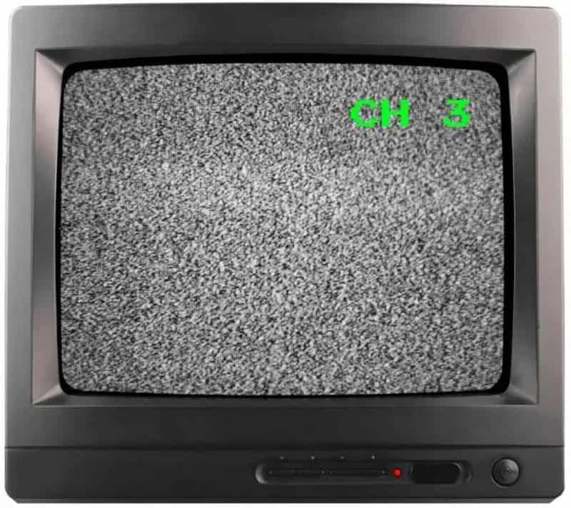 Old CRT TV showing static with green text 'CH 3' on screen.