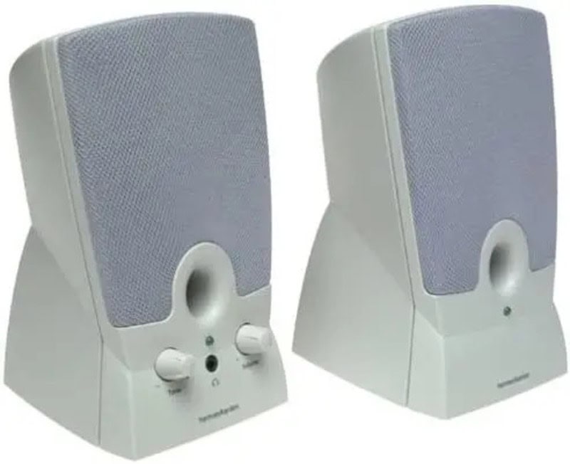 Pair of white computer speakers with gray speaker covers and control knobs.