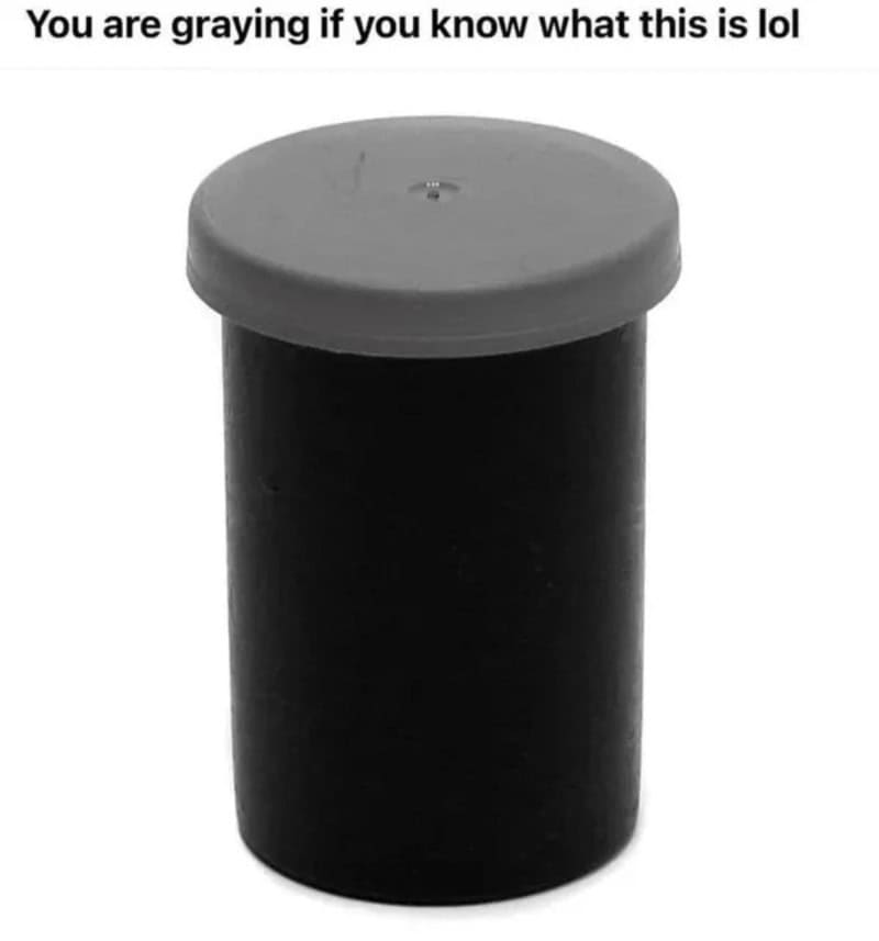 Black cylindrical object with a gray lid, captioned 'You are graying if you know what this is lol'.