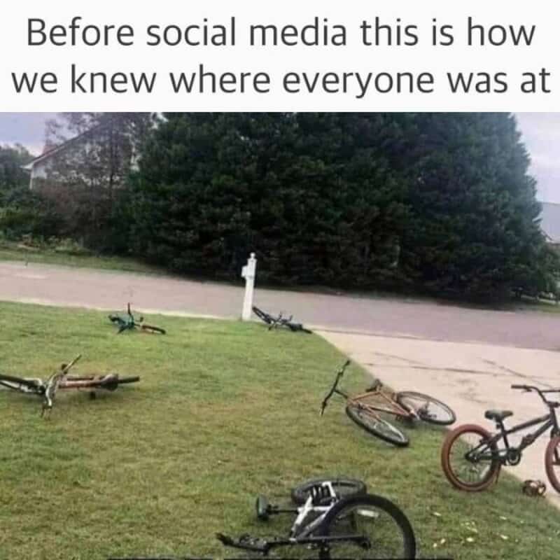 Bicycles lying on the grass and sidewalk with a caption about social media.