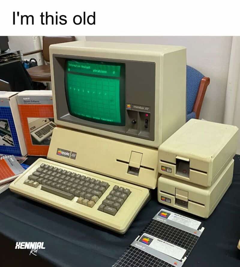 Old Apple Macintosh computer with floppy disk drives and monochrome monitor.