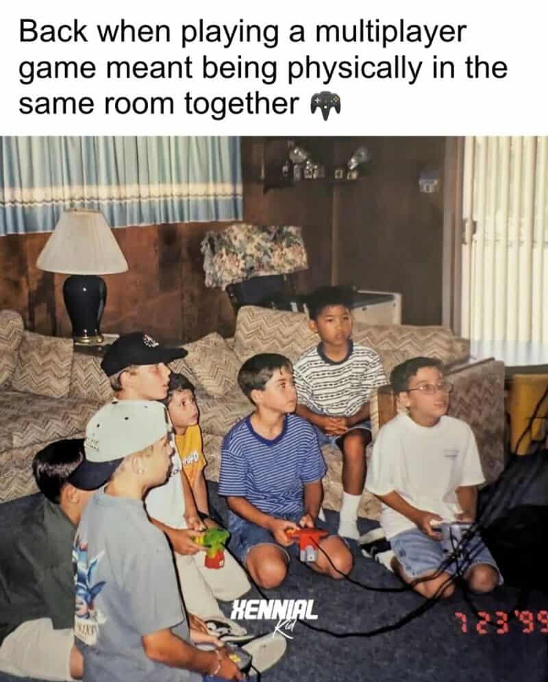 Group of kids playing video games together in a living room.