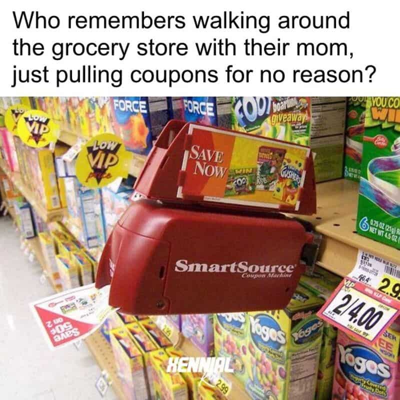 Grocery store coupon machine with coupons and shelves of snacks in background.