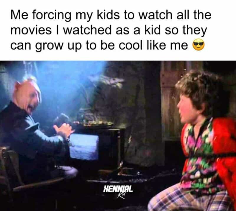 Kids watching movies with a humorous caption about growing up to be cool.