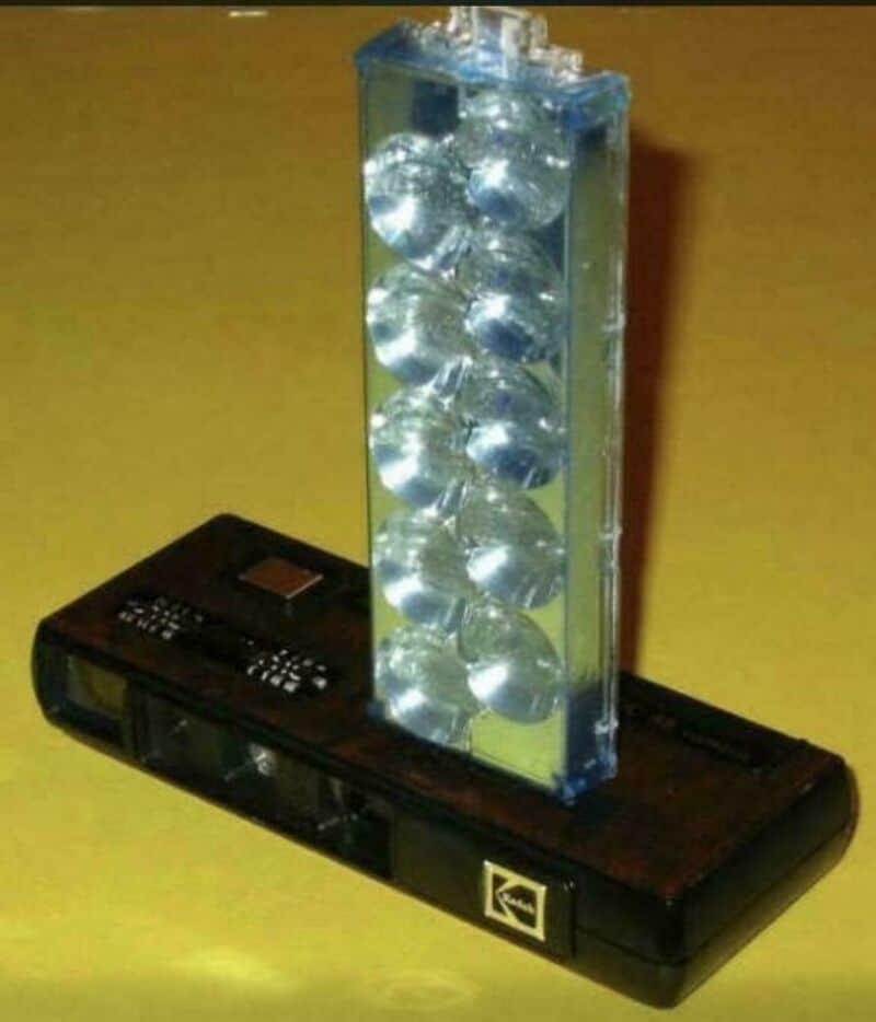 Vintage electronic game with a vertical transparent tube filled with silver balls.