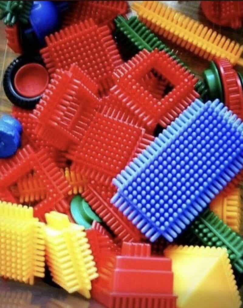 Colorful plastic building blocks and pieces from the 80s.