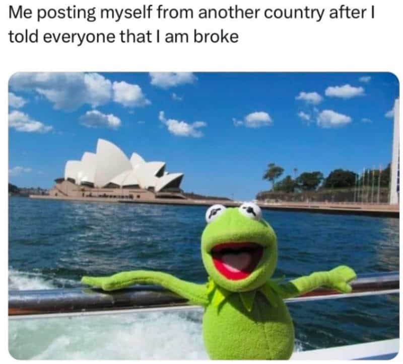 Kermit the Frog plush toy on a boat with Sydney Opera House in background.