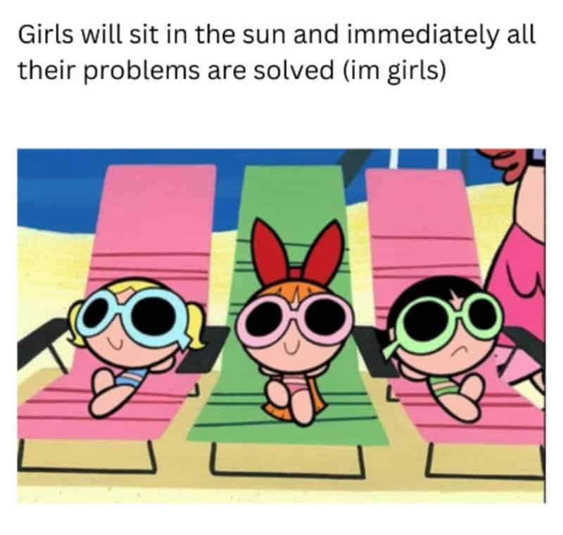 Girls sitting on lounge chairs with sunglasses, relaxing at the beach.