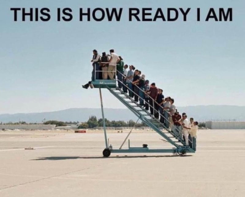 People standing on a mobile staircase at an airport with the caption 'This is how ready I am'.