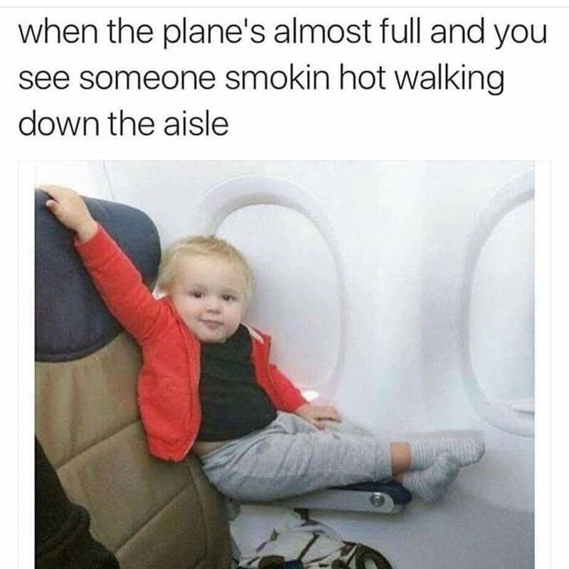 Child sitting in airplane seat with arm raised, caption about seeing someone smoking hot.