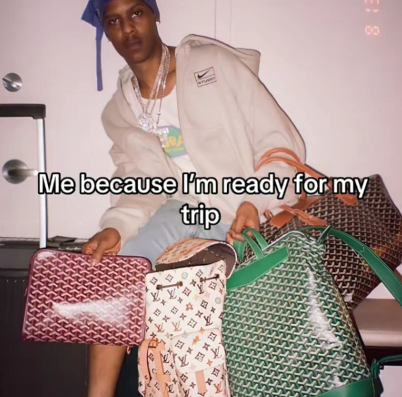 Person with luggage and bags, caption: 'Me because I'm ready for my trip'.