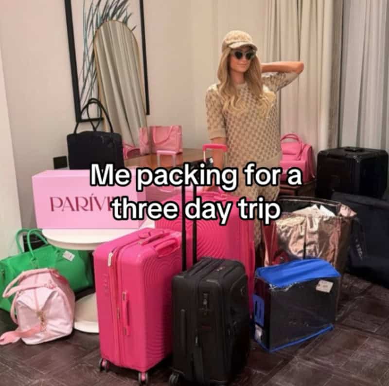 Woman packing for a trip with multiple suitcases and bags, text overlay says 'Me packing for a three.
