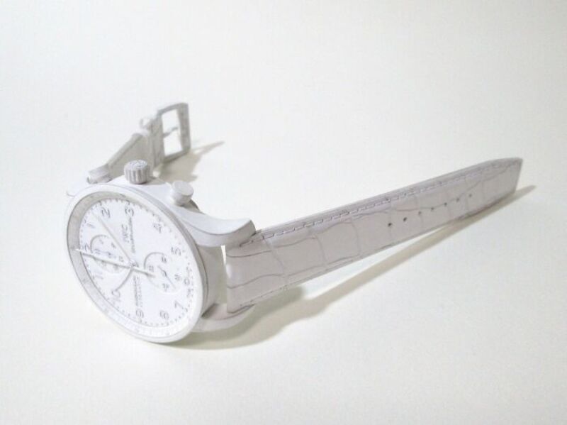 Paper watch sculpture with detailed face and band, part of retro electronics series.